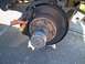 1994 Ford Bronco - View with the wheel off and the clamp depressing the caliper.