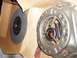 1979 Ford Bronco - A new clutch disc sits in its cardboard packaging beside the clutch pressure plate assembly, showing handwritten markings.