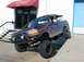 1996 Ford Bronco - This modified Ford Bronco is parked on an incline, its off-road capabilities.