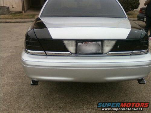 Rear view of a 1998 Ford Crown Victoria showing custom black taillight surrounds and chrome trim