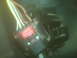 2001 Ford F-250 - A close-up view of a vehicle's electrical wiring harness and a red relay component.
