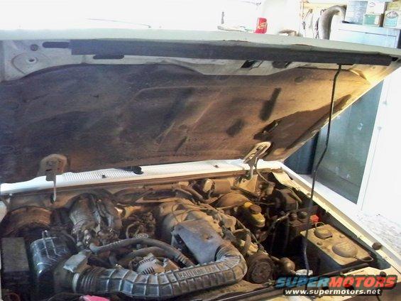 1994 Ford Explorer engine bay with hood open, showing engine components and wiring