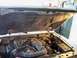 1994 Ford Explorer - The engine bay of a 1994 Ford Explorer is visible with the hood raised, revealing the engine and surrounding parts.