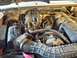 1994 Ford Explorer - The engine bay of a 1994 Ford Explorer, its V6 engine and various components.