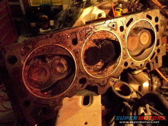 Engine cylinder head with visible valves and combustion chambers