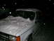 1994 Ford Explorer - White 1994 Ford Explorer parked outside during a snowstorm at night.