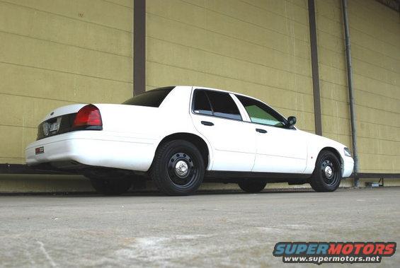 White 1998 Ford Crown Victoria, rear 3/4 view