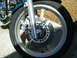 1992 Yamaha Virago - This image focuses on the front wheel assembly of a motorcycle, highlighting the brake system and wheel design.