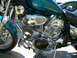 1992 Yamaha Virago - Close-up of a 1992 Yamaha Virago motorcycle engine with chrome details and a teal fuel tank.