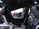 1992 Yamaha Virago - A reflection in the chrome side cover of a motorcycle shows a photographer and a child.