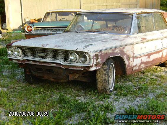 1963 Ford Galaxie front end with rust damage, parked next to another vintage car