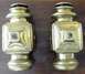 1912 Ford Model T - A pair of vintage brass carriage lamps are displayed on a wooden surface.