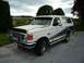 1988 Ford Bronco - This 1988 Ford Bronco features a two-tone paint scheme with blue accents and a protective front push bar.