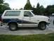 1988 Ford Bronco - This 1987 Ford Bronco shows signs of wear and tear, with visible rust on its body panels.