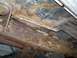 1988 Ford Bronco - Undercarriage frame shows significant rust and corrosion, indicating potential structural compromise.