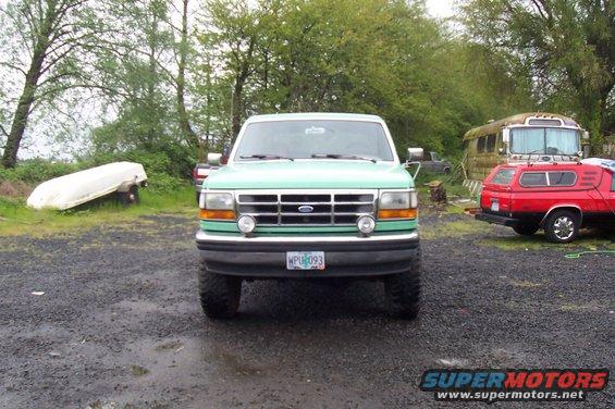 Green 1993 Ford Bronco front view with license plate WPU093