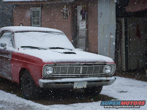 1966 Ford Ranchero front end in snow, showing grille and Ford badge