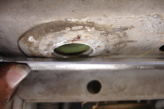close-up of vehicle subframe with a wrench nearby