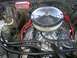 1979 Chevrolet C/K Pickup - Close-up view of a modified V8 engine, chrome accents and aftermarket ignition components.