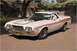 1972 Ford Ranchero - This 1972 Ford Ranchero features a distinctive orange stripe along its side and a hood scoop.