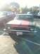1973 Chevrolet Nova - This 1973 Chevrolet Nova is captured from the front, distinctive red racing stripes on its hood.