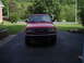 1997 Ford Ranger - Front view of a red 1997 Ford Ranger pickup truck parked in a driveway.