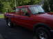 1997 Ford Ranger - 1997 Ford Ranger XLT extended cab pickup truck parked on asphalt.