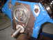 1969 Ford Torino - Engine timing chain and gears assembly on a blue painted block.