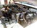 1996 Ford Bronco - Engine bay of a white vehicle, showing custom modifications and aftermarket components.