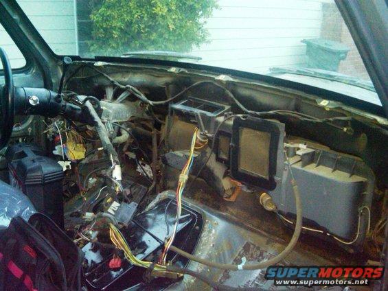 1986 Ford Bronco interior with disassembled dashboard and exposed wiring