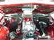 1992 Ford Bronco - Customized engine bay features a prominent supercharger and polished components.