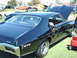 1992 Ford Bronco - A black 1969 Pontiac GTO is displayed at a car show, with other vehicles in the background.
