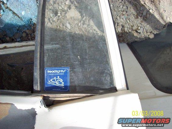 Blue "Tread Lightly!" sticker on a vehicle window
