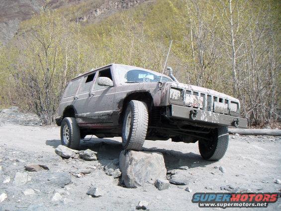 1998 Jeep Cherokee on a rock during off-road driving