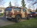 1985 Ford Bronco - This 1985 Ford Bronco features a distinctive camouflage paint scheme and appears to be lifted with off-road tires.