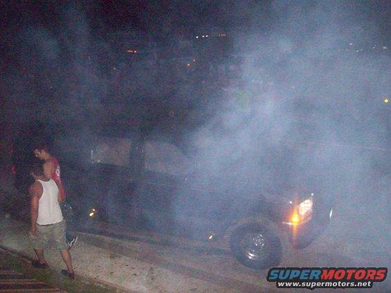 Truck emitting a large amount of smoke, obscuring much of the vehicle