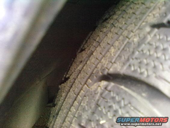 Close-up of a tire and wheel well
