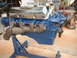 1969 Ford Torino - A Ford 427 engine, identified by the badge on the valve cover, is displayed on a blue engine stand.