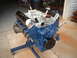 1969 Ford Torino - Blue V8 engine on a stand, ready for installation or rebuild.