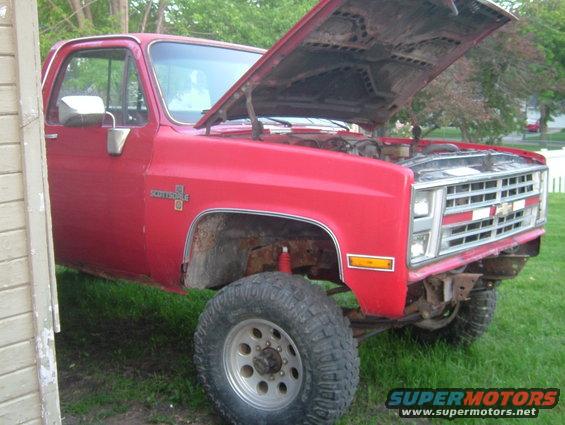 1985 Chevrolet C/K Pickup, red, hood open, parked on grass
