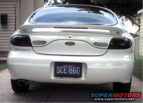 White 1997 Ford Taurus rear view with tinted taillights and 'SPORT' badge