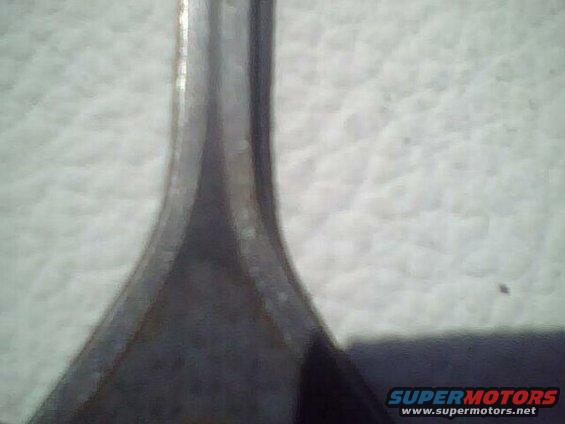 Close-up of a textured car door panel with a metal trim piece