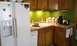 2006 Ford E350 - A typical kitchen scene a refrigerator, sink, and countertop appliances.