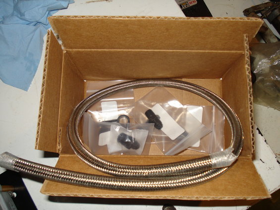 Braided fuel line and fittings in a cardboard box