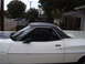 1973 Ford Ranchero - A white pickup truck with a black vinyl top is parked in a residential area. The number 500 is visible on the fender.