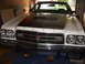 1973 Ford Ranchero - This 1973 Ford Ranchero features a distinctive black hood stripe and a prominent front grille.