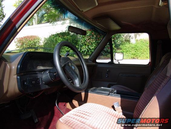 1991 Ford Bronco interior showing brown seats, dashboard, and steering wheel