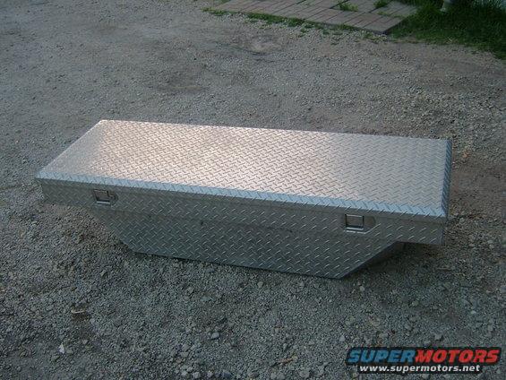 diamond plate aluminum truck bed toolbox on gravel