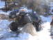 1994 Ford Bronco - A modified Ford Bronco navigates a rocky, snow-covered trail.