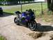 2006 Suzuki GSX-R 1000 - Front view of a blue and black 2006 Suzuki GSX-R 1000 sport motorcycle parked outside.